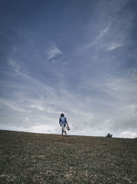 Man riding bicycle on field