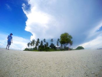 Man against cloudy sky