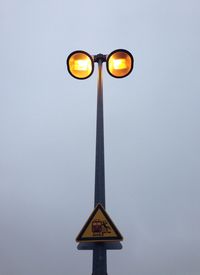 Low angle view of illuminated street light