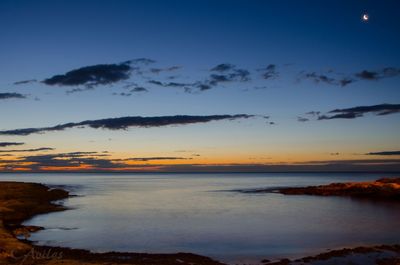 Scenic view of sea at sunset