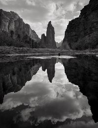 Scenic view of lake and rock formation against sky