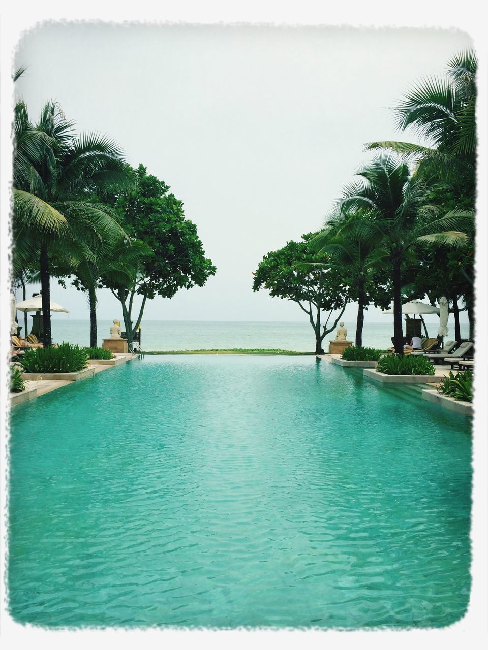 water, tree, sea, palm tree, transfer print, tranquil scene, tranquility, beach, scenics, auto post production filter, horizon over water, beauty in nature, clear sky, nature, sky, shore, vacations, incidental people, sand, waterfront