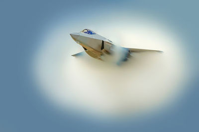 Close-up of toy flying over white background