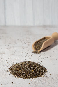 Heap of chia seeds with wooden spoon. healthy superfood rich in omega 3 fatty acids. dry healthy