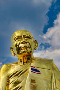 Low angle view of statue against sky