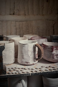 Close-up of containers on shelf