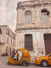 Old car against building in city