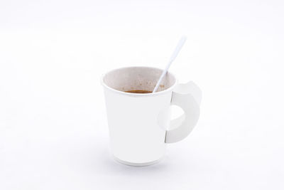 Close-up of coffee cup against white background