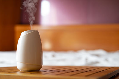 Close-up of white wine on table at home