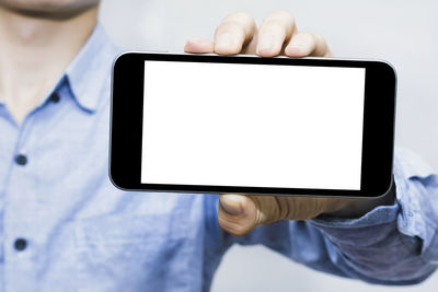 Low angle view of person using mobile phone