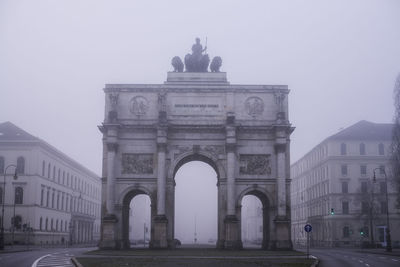 Siegestor in city during foggy weather