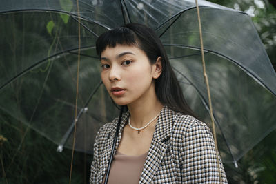 Portrait of young woman looking away