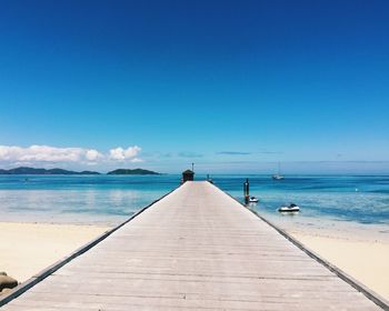 Pier over sea against sky