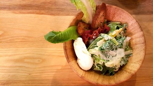 High angle view of chopped vegetables in bowl on table