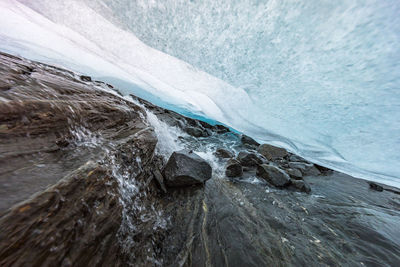 Scenic view of glacier against sky