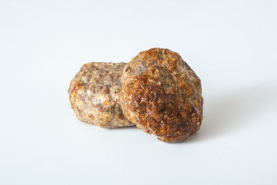 Close-up of bread against white background