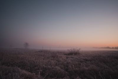 Scenic view of sea against clear sky during sunset