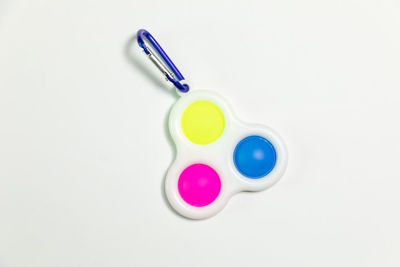 High angle view of multi colored pencils on white background