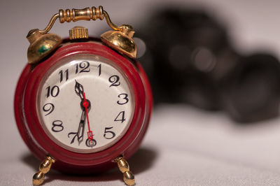 Close-up of clock on table