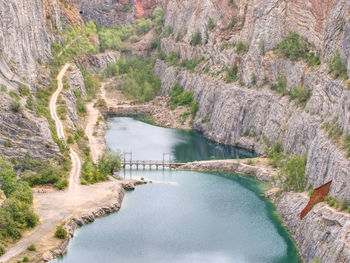 Scenic view of river amidst mountains