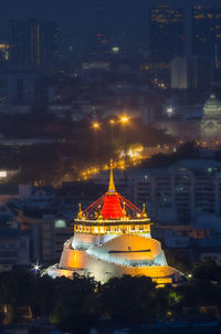 Temple in city at night