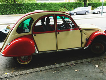 Vintage car parked on road