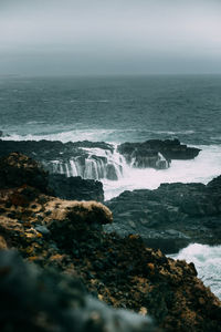 Waves splashing on rocks