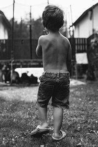 Rear view of shirtless boy