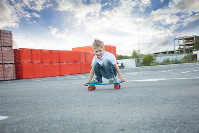 Full length portrait of boy skateboarding