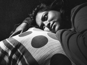 Close-up portrait of baby lying down