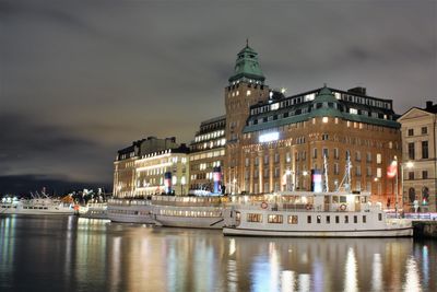 Illuminated buildings in city at night