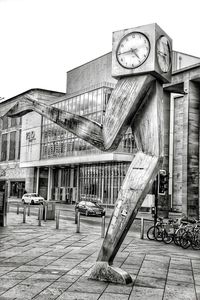 Low angle view of clock against building