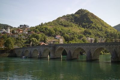 Bridge over river against sky