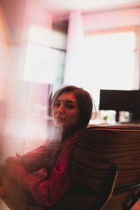 Portrait of young woman looking away