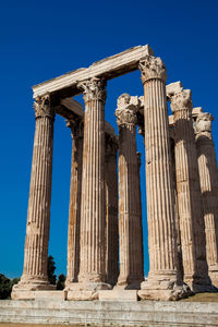 Ruins of the temple of olympian zeus also known as the olympieion and the acropolis in athens 