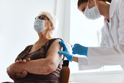 Midsection of woman holding hands