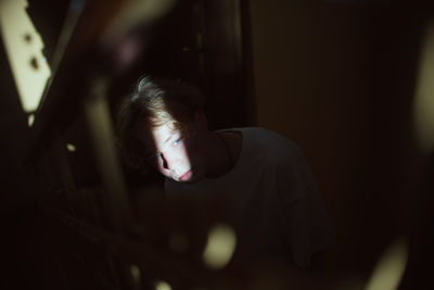 Depressed young man looking away on steps