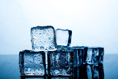 Close-up of ice cubes on table