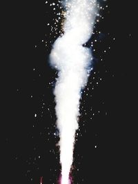 Low angle view of firework display at night