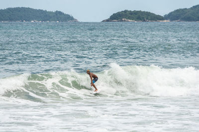 Man surfing in sea