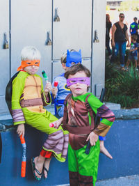 Portrait of children standing outdoors