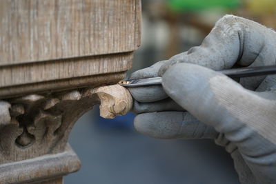 Close-up of hand holding sculpture