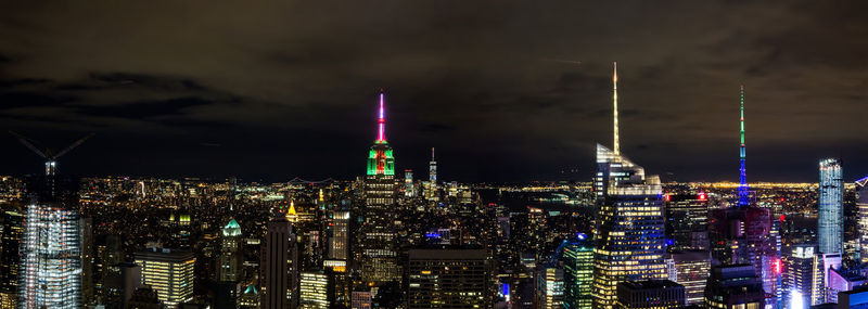 Illuminated buildings in city at night