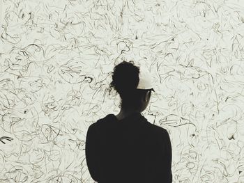 Woman standing in the dark