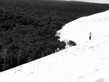 High angle view of man on frozen landscape