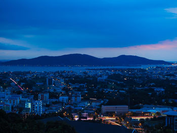 High angle view of illuminated buildings in city at night