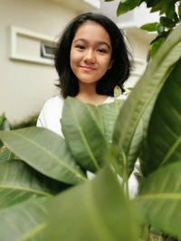 Portrait of smiling young girl standing outdoors