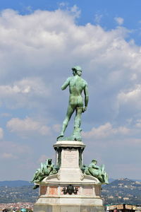 Low angle view of statue against sky