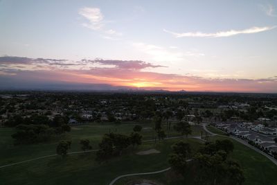 High angle view of cityscape against sky during sunset