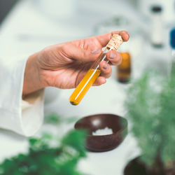 Cropped hands of female scientist experimenting in laboratory